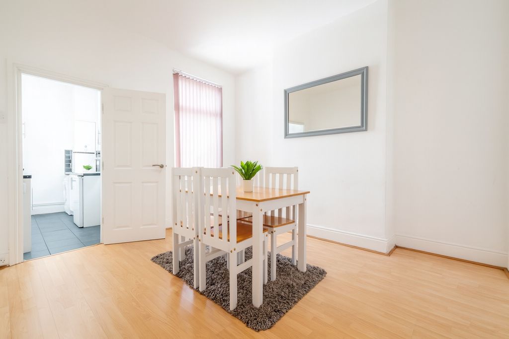 Property photo 1 of 6 Bright And Welcoming Living Room Featuring Natural...