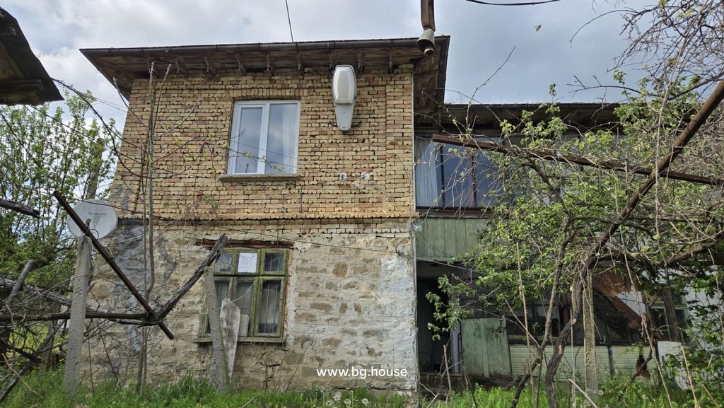 Property photo 3 of 100 Close-Up View Of The Two-Storey House Showing Stone Lower Walls, Brick Upper Walls, Windows, And A Glazed Enclosed Terrace.