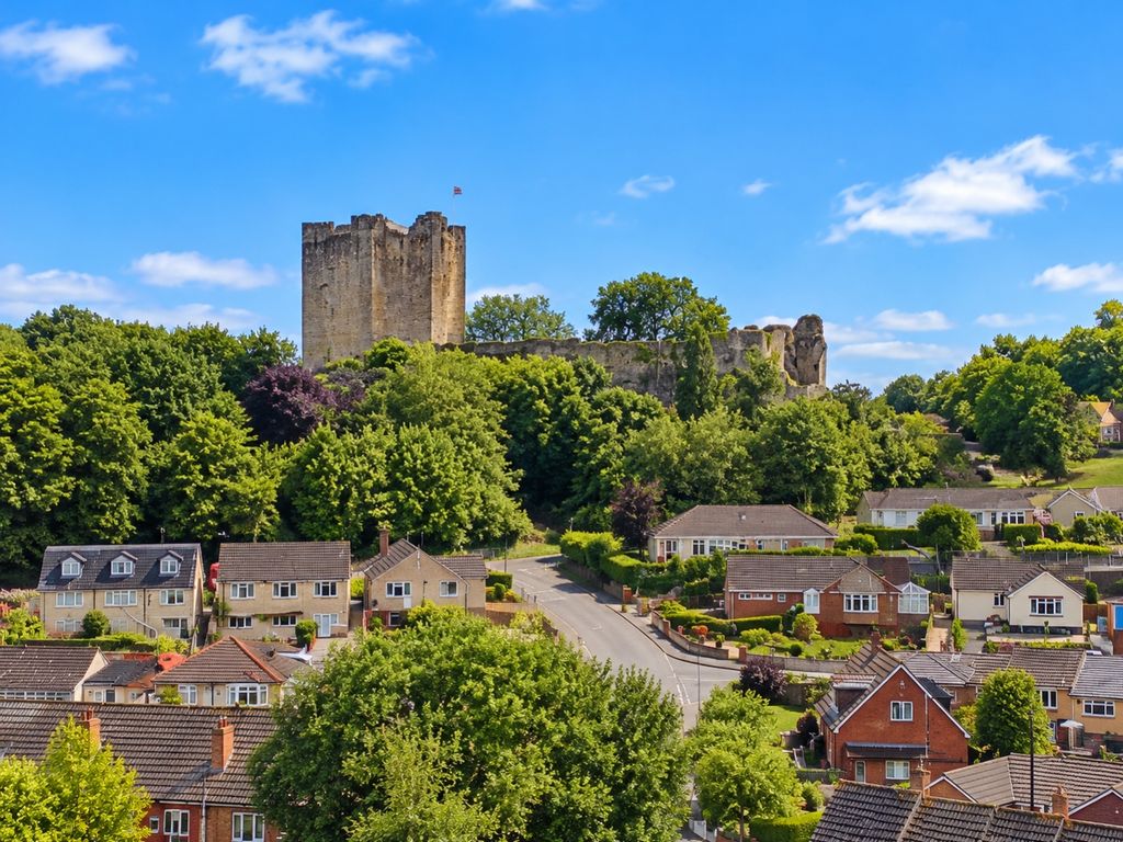 Property photo 2 of 17 Sunny Castle Ruins Above Suburban Neighborhood
