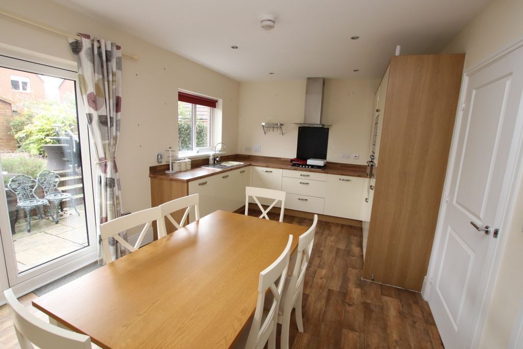 Property photo 3 of 13 Dining Kitchen