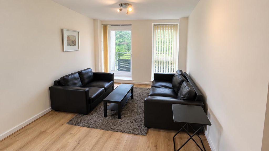 Property photo 2 of 9 Bright Living Room With Comfy Sofas And A Balcony...