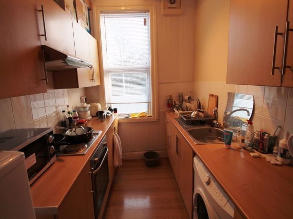 Property photo 2 of 3 A Compact Kitchen With Natural Light From A Window...