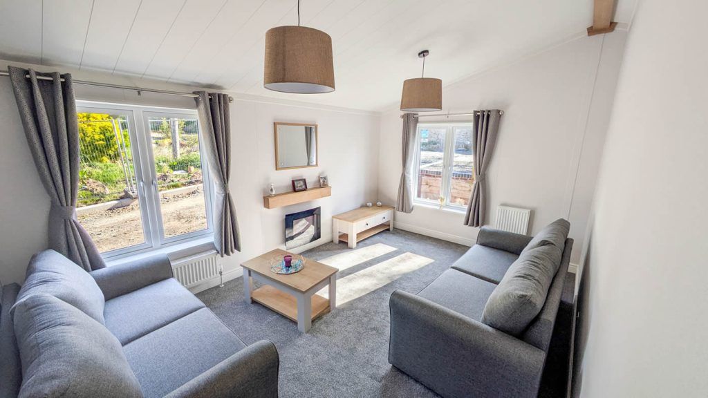 Property photo 1 of 11 Contemporary Lounge With Grey Sofas And Windows