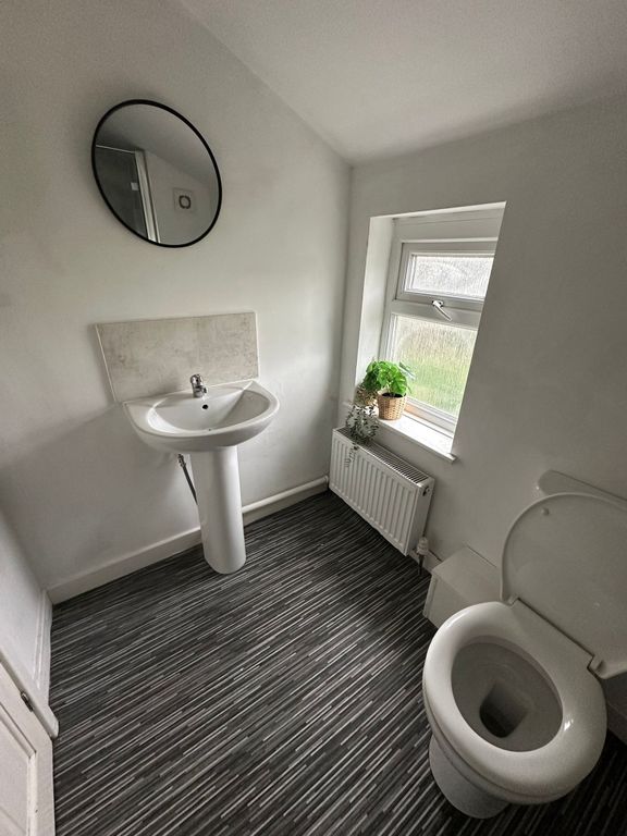 Property photo 3 of 17 Bright And Clean Bathroom Featuring A White Pedest...