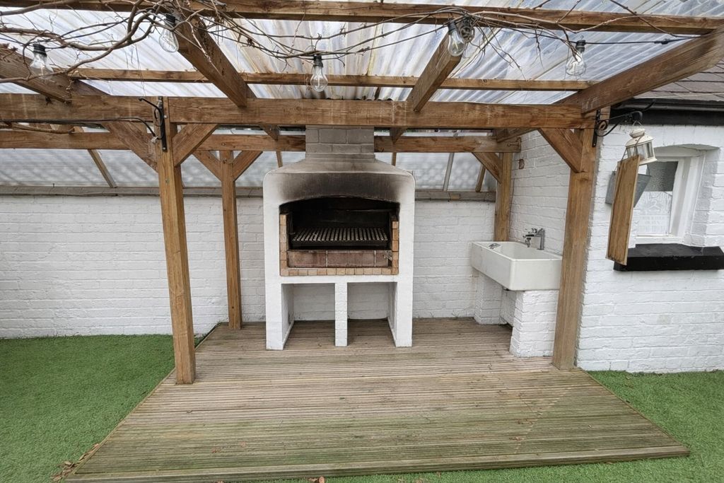 Property photo 3 of 13 Covered Outdoor Grilling Area With A Built-In Bric...