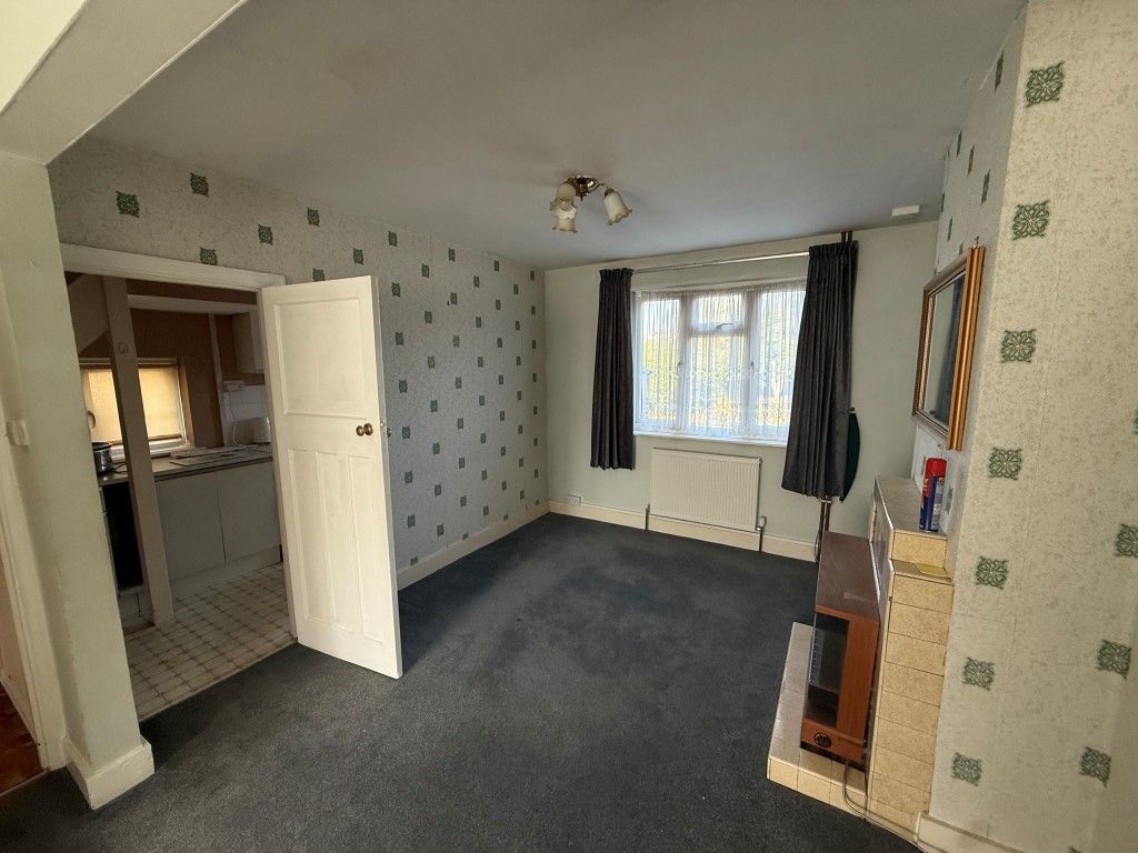 Property photo 3 of 10 Dining Area With Fireplace, Window And Radiator With Access To Kitchen