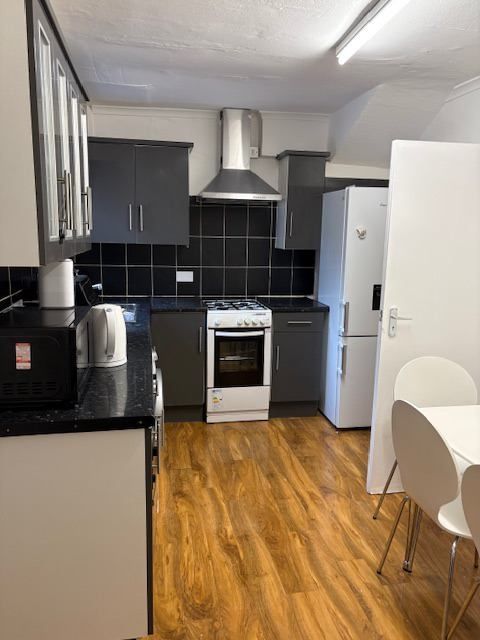 Property photo 3 of 5 Modern Kitchen With Sleek Units And Dining Area...