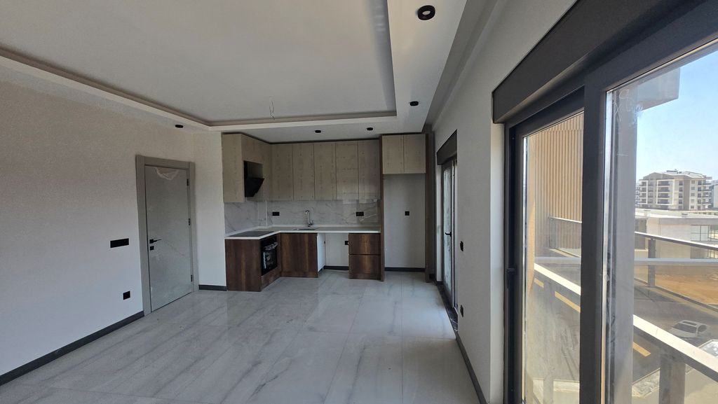 Property photo 2 of 10 Residential Antalya Apartments In Altintas For Sale - Open-Plan Living Room And Kitchen