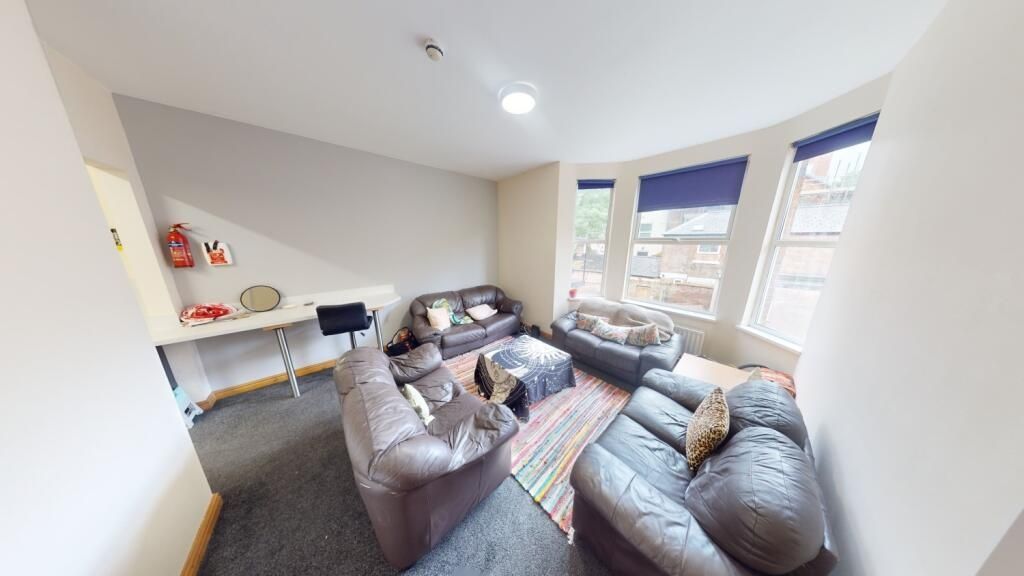 Property photo 1 of 9 Bright And Comfortable Living Room Featuring Large...