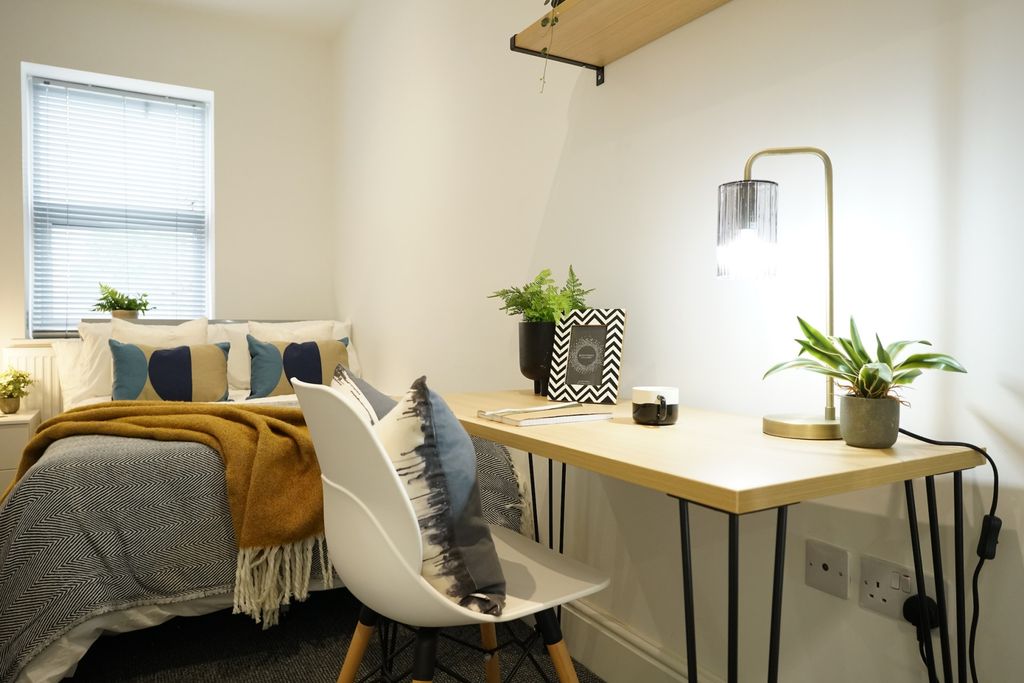 Property photo 3 of 10 A Bright And Welcoming Living Room Featuring Natur...