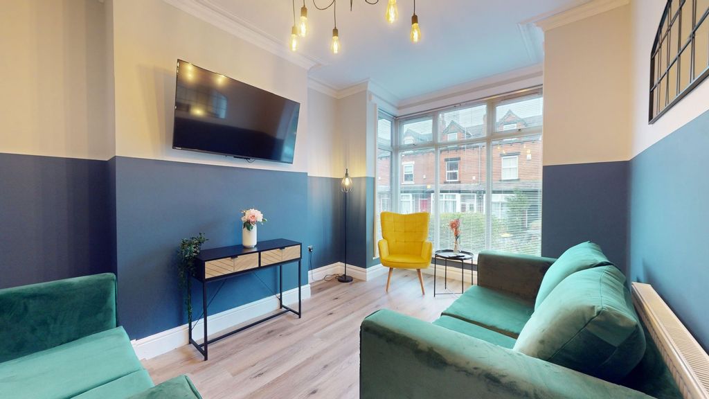 Property photo 2 of 12 This Contemporary Living Room Features Stylish Fur...