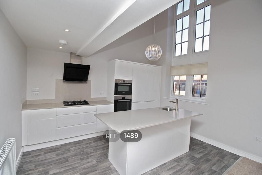 Property photo 2 of 9 Kitchen/Living Area