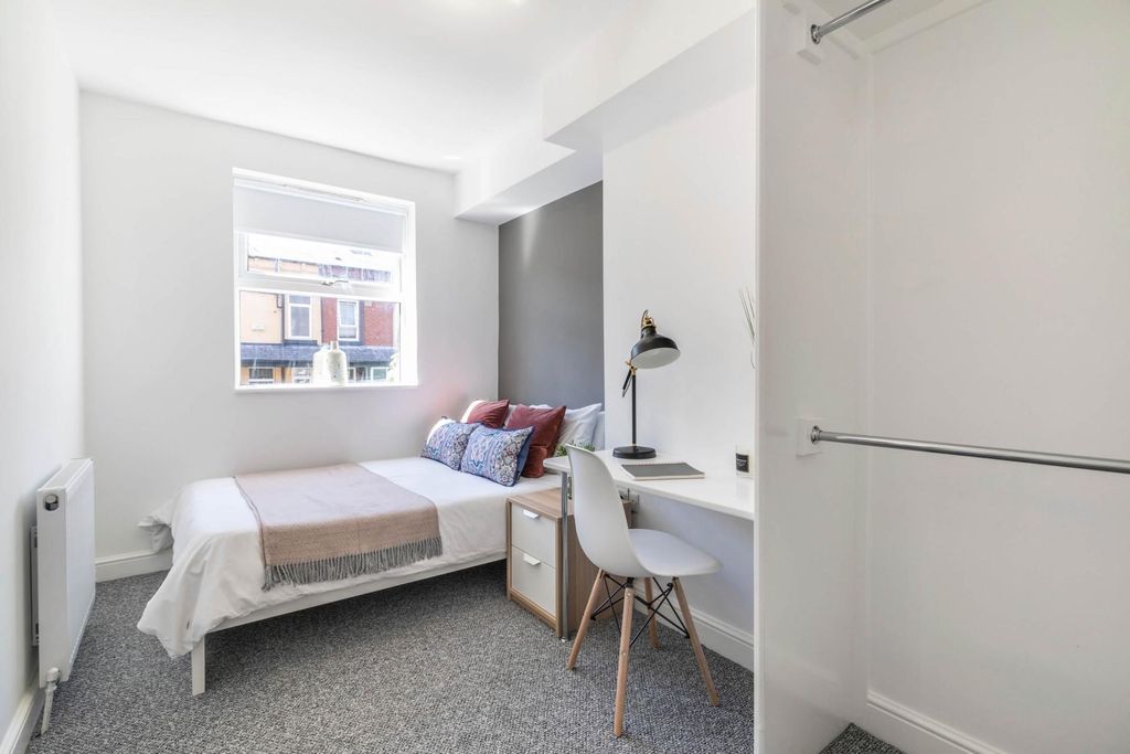 Property photo 3 of 17 A Bright And Tidy Bedroom Featuring A Comfortable ...