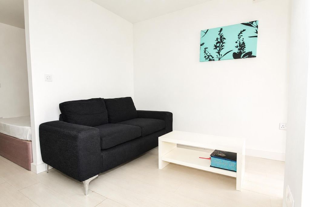 Property photo 2 of 7 Bright Lounge With A Sleek Sofa And Coffee Table...