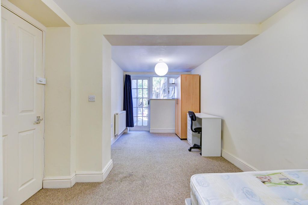 Property photo 2 of 27 A Bright And Welcoming Living Room Featuring Ample...