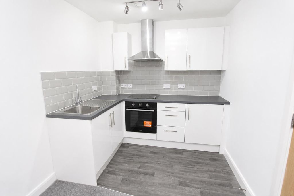 Property photo 3 of 7 Modern Kitchen With Sleek White Cabinets...