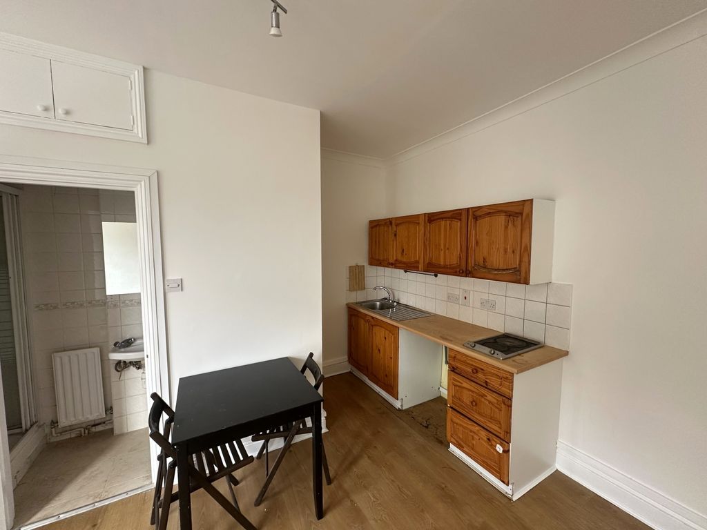 Property photo 2 of 5 Compact Kitchen With Dining Table And Natural Tone...