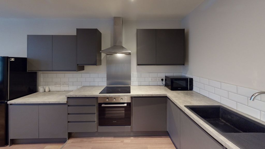 Property photo 1 of 15 A Modern And Spacious Kitchenette With Sleek Cabin...