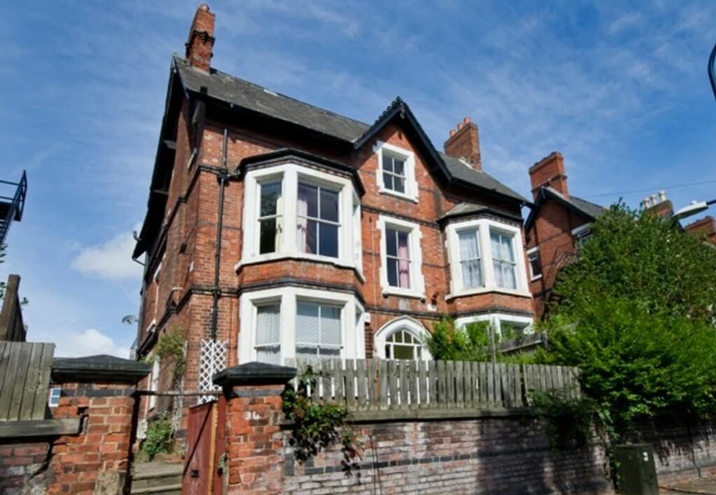 Property photo 3 of 7 A Charming Exterior View Of A Well-Maintained Red-...