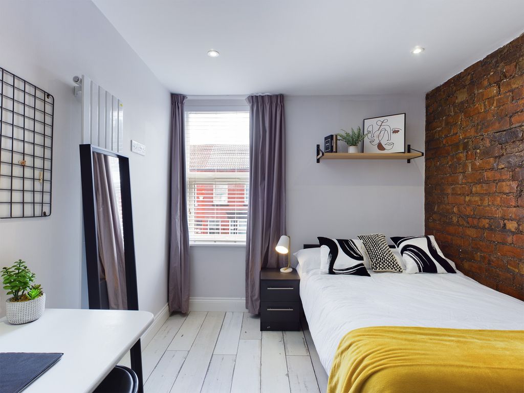 Property photo 3 of 5 A Bright And Inviting Bedroom Featuring A Comforta...