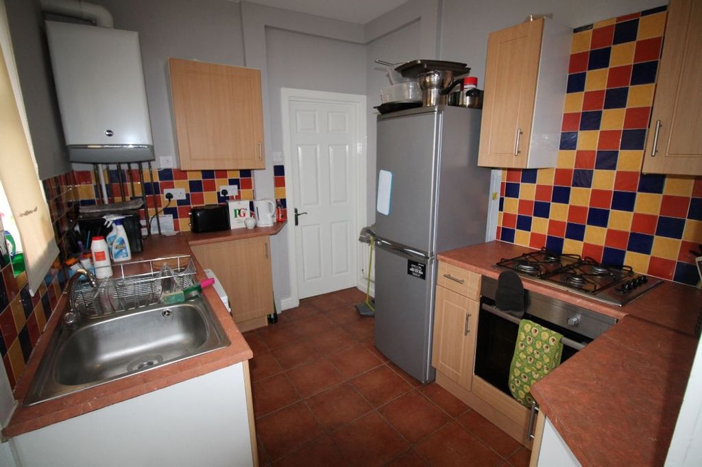 Property photo 3 of 8 Bright And Functional Kitchen Featuring A Good Amo...