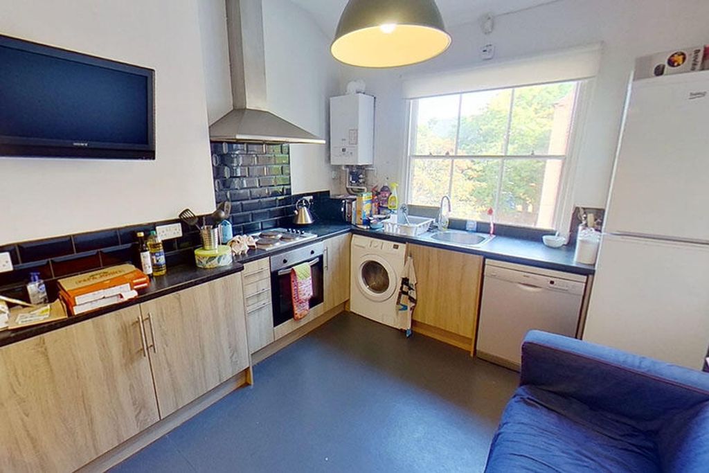 Property photo 3 of 4 Bright And Modern Kitchen Featuring Ample Countert...