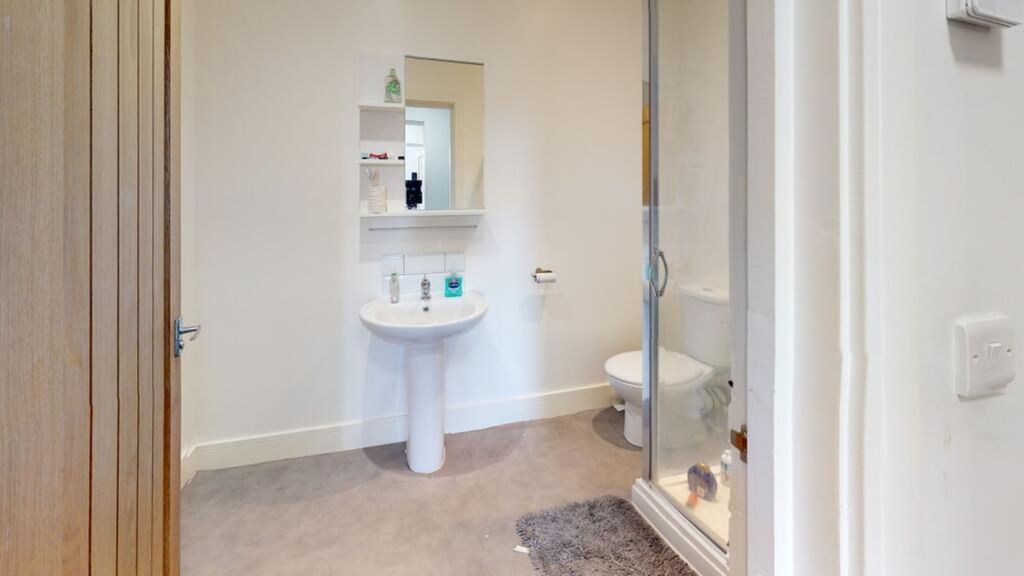 Property photo 2 of 10 This Modern Bathroom Features A Sleek Design With ...