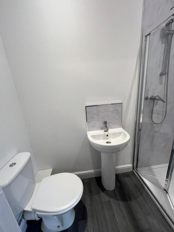 Property photo 2 of 8 A Modern, Clean Bathroom Featuring A White Toilet,...