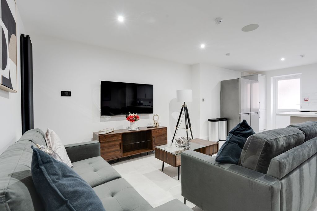 Property photo 2 of 12 Bright And Contemporary Living Room Featuring Comf...