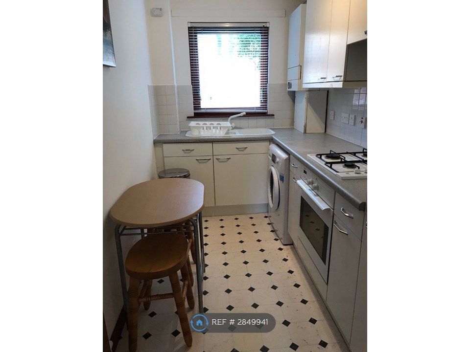 Property photo 2 of 13 Kitchen With Small Table And Seats.