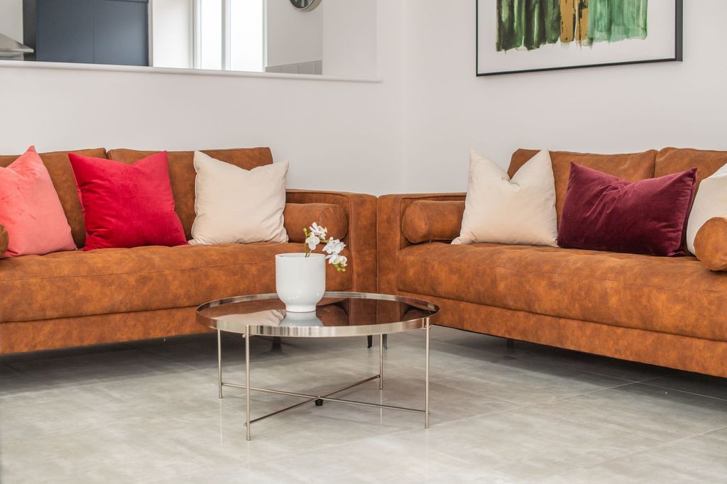 Property photo 2 of 8 A Contemporary Living Room Featuring Two Large Bro...