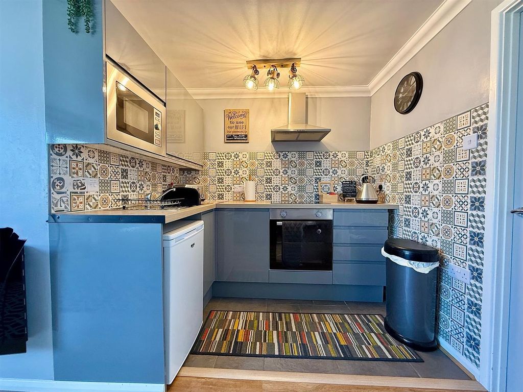 Property photo 2 of 11 Kitchen Area