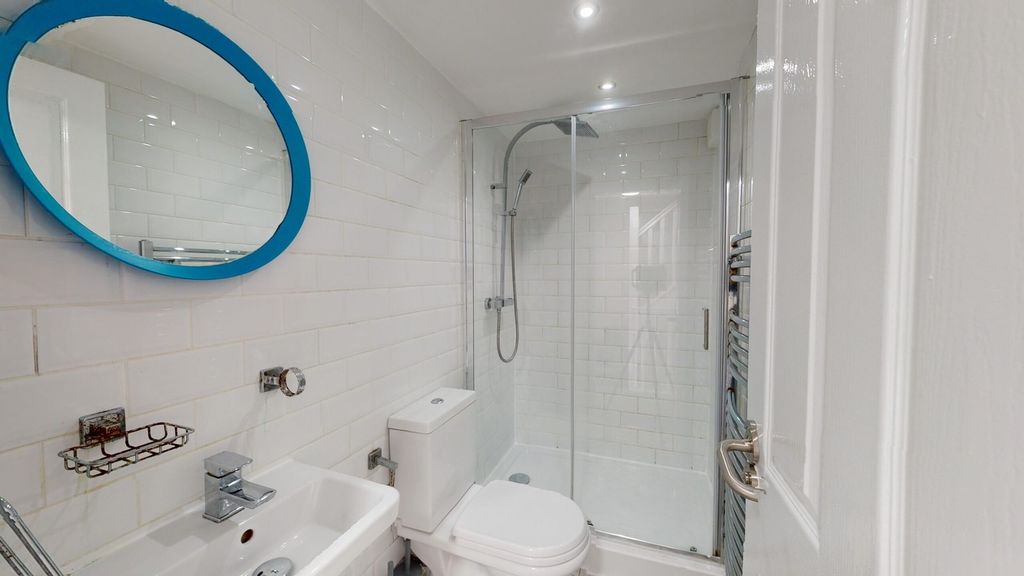 Property photo 2 of 13 A Modern And Clean Bathroom With A Stylish Shower,...
