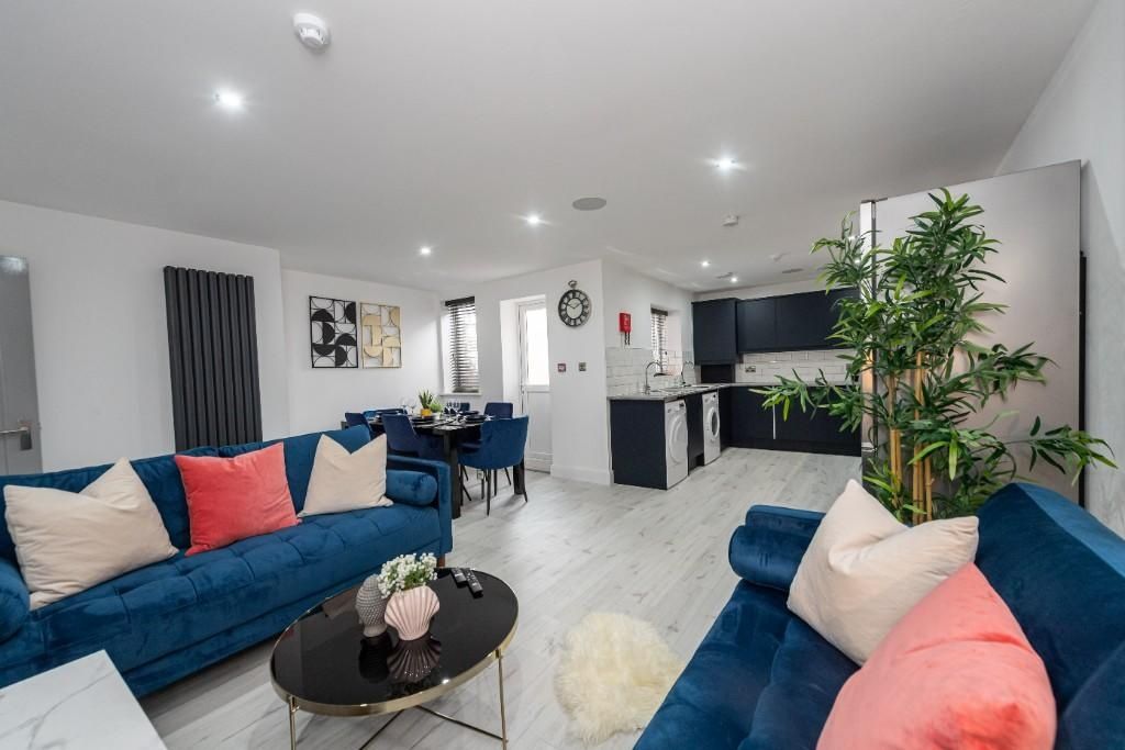 Property photo 1 of 15 Bright And Spacious Living Room Featuring Comforta...