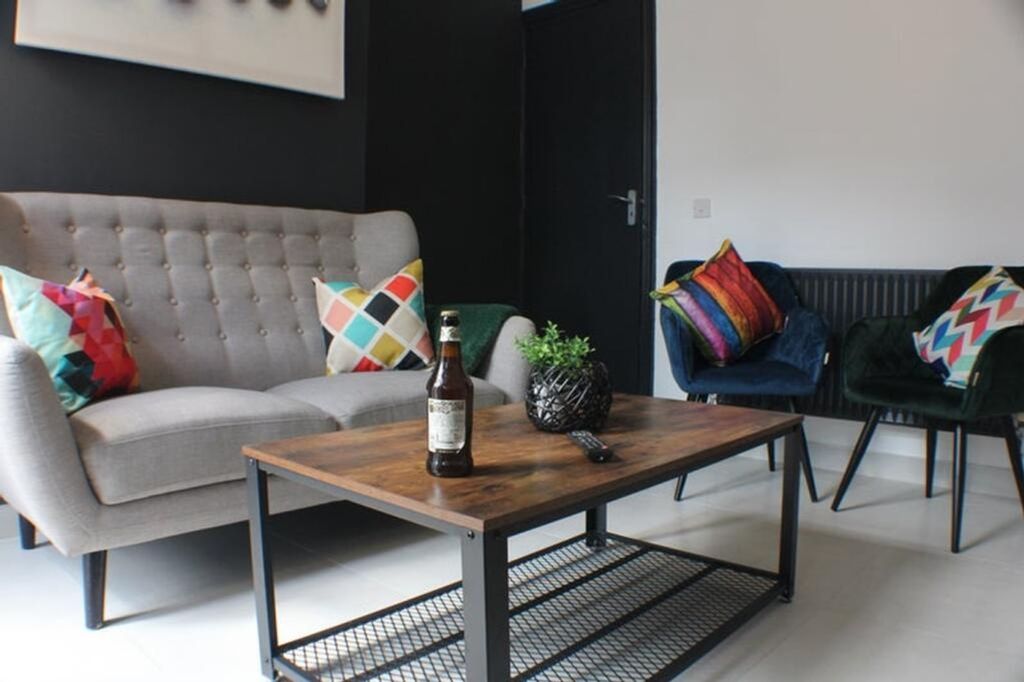 Property photo 2 of 8 A Stylish Living Room Featuring A Comfortable Sofa...