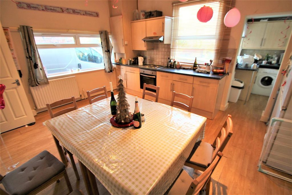 Property photo 2 of 8 Bright And Inviting Kitchen Area With Ample Natura...