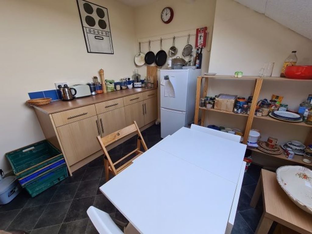 Property photo 3 of 7 Bright And Functional Kitchen Area Featuring Ample...