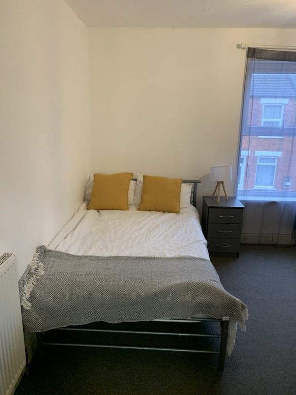 Property photo 2 of 6 Bright Bedroom With Stylish Yellow Accents...