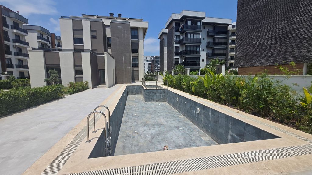 Property photo 2 of 11 Ground-Floor Apartment In Antalya For Sale - Communal Swimming Pool