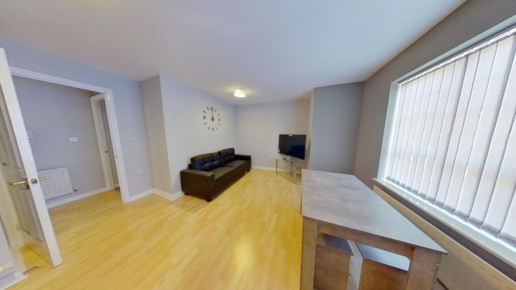 Property photo 2 of 8 A Bright And Welcoming Living Room Featuring Light...