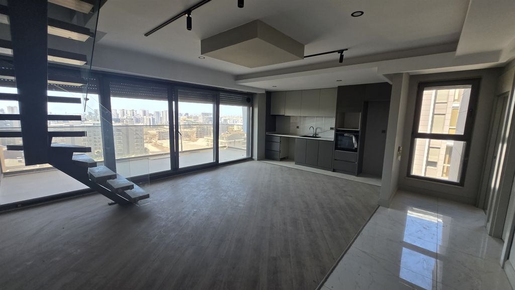 Property photo 3 of 16 City View Apartment For Sale In Antalya - Spacious, Open-Plan Living Room