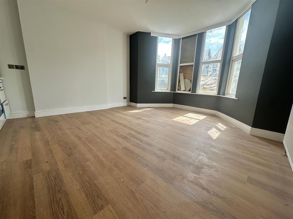 Property photo 3 of 8 Bright Lounge With A Bay Window And Wood Floors...
