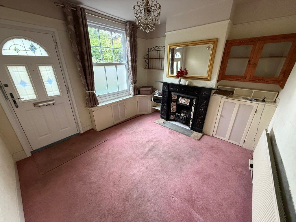 Property photo 2 of 9 Living Room Showing Window, Fireplace And Front Door