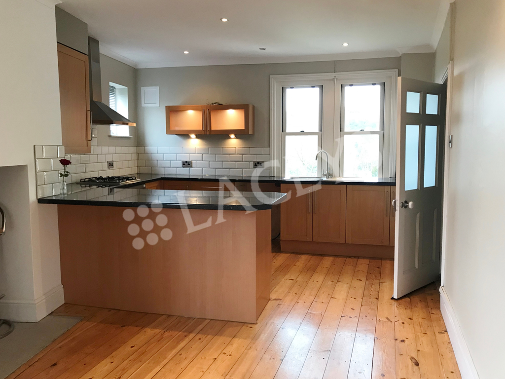 Property photo 3 of 9 Kitchen Area