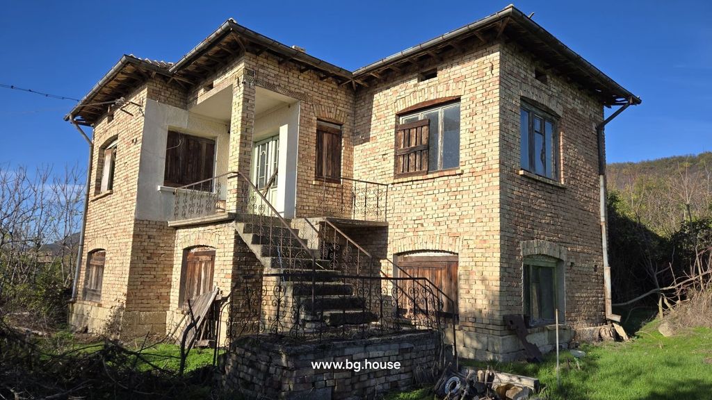 Property photo 1 of 35 Exterior View Of A Two-Storey Brick House Featuring Wooden Shutters And An Iron-Railed External Staircase.