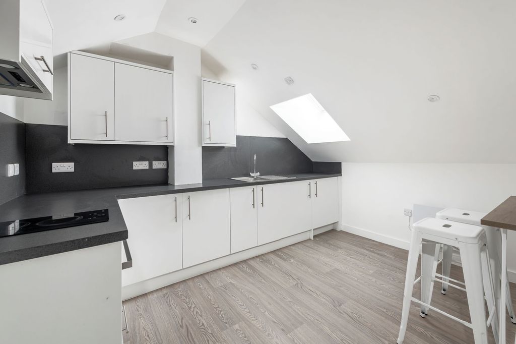 Property photo 3 of 4 A Modern And Bright Kitchenette With Sleek Cabinet...