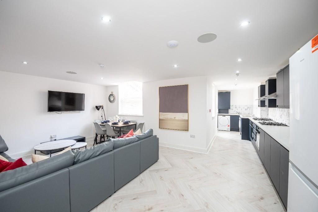 Property photo 1 of 15 A Modern, Spacious Living Room With Plenty Of Natu...