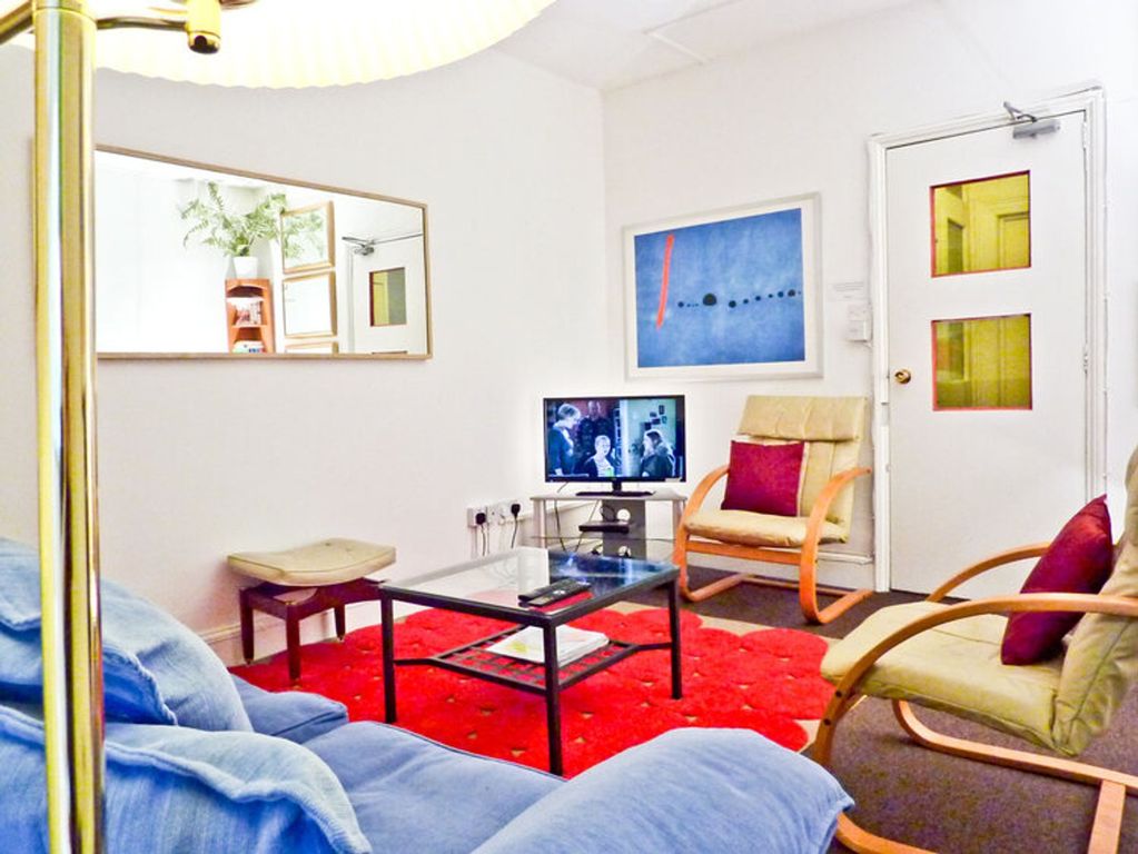 Property photo 3 of 6 A Cozy Living Room With Comfortable Seating And A ...