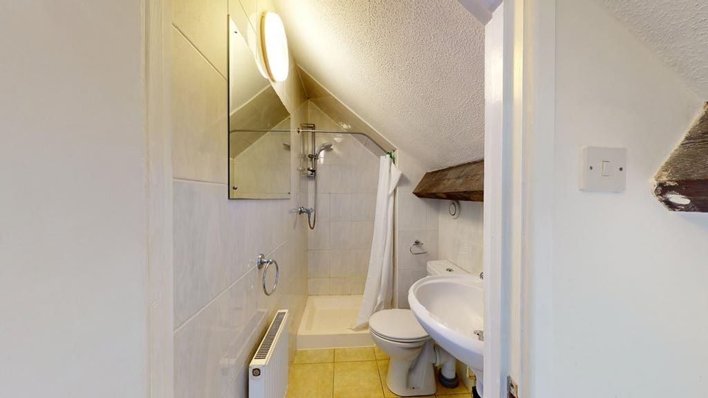 Property photo 1 of 25 A Clean And Functional Bathroom With Ample Natural...