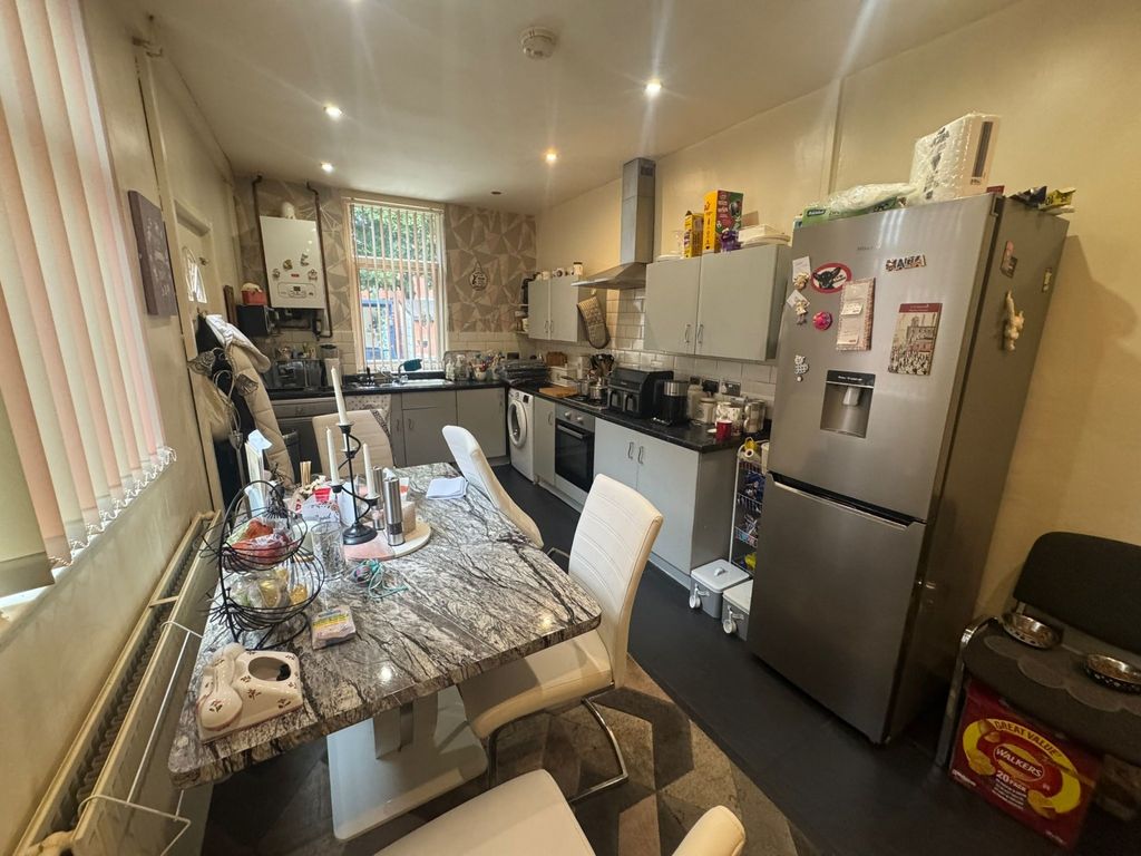 Property photo 1 of 8 A Functional Kitchen Featuring A Dining Table With...